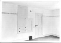 SA0450 - Photograph of a second floor room with built-in cupboards and drawers and wall pegs. Identified on the back., Winterthur Shaker Photograph and Post Card Collection 1851 to 1921c